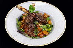 Lamb Saratoga Rack with Tokaji Aszú-Infused Peach Salad